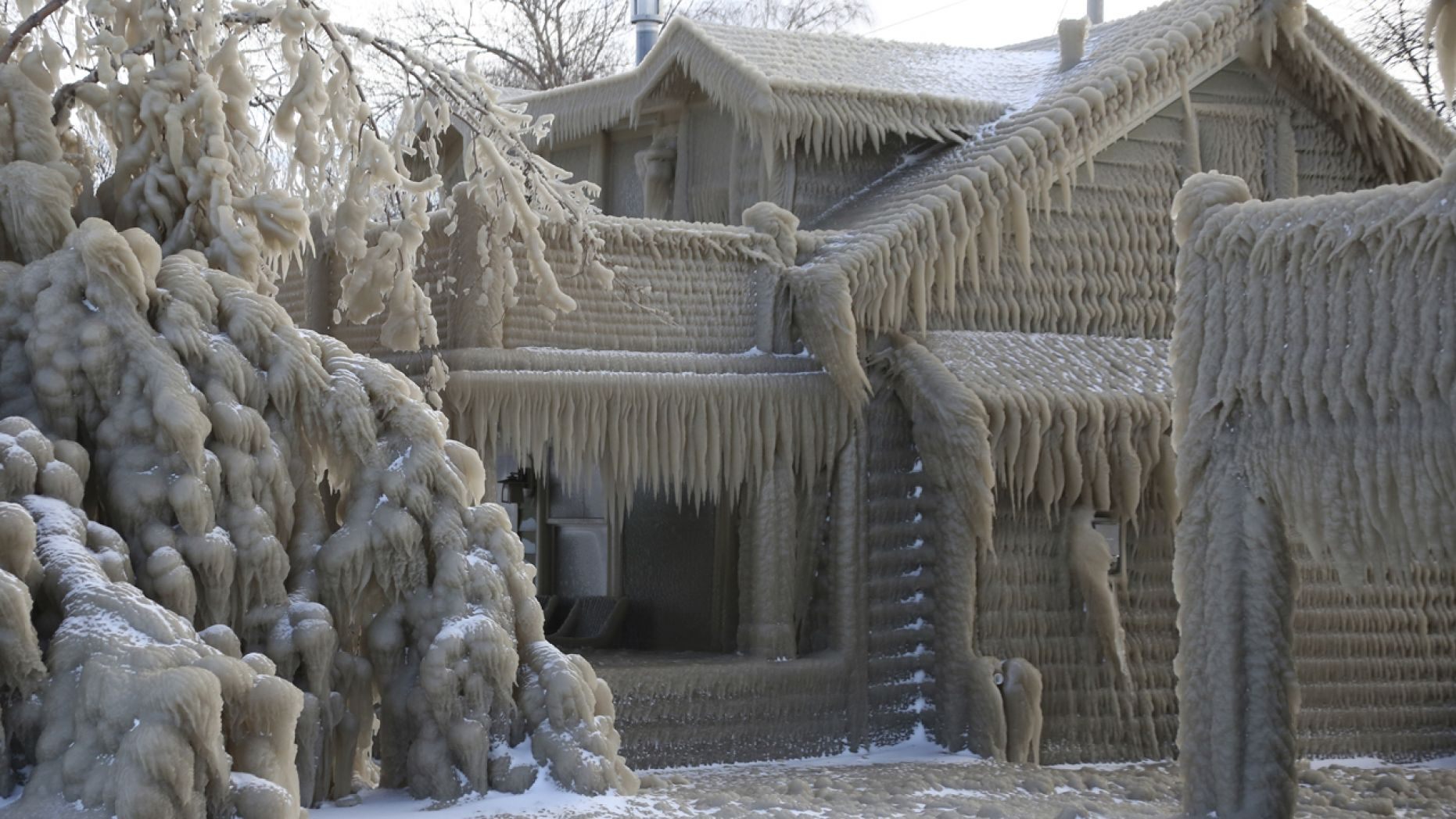 Frozen house upstate NY. AP Photo Jeffrey T. Barnes